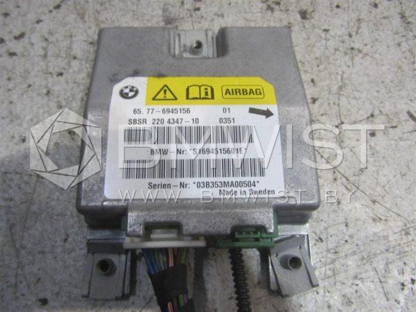 37077